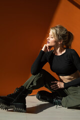 Beautiful fashion woman blonde military style