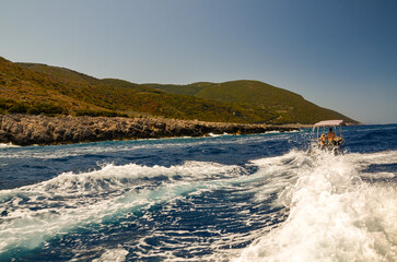 Zakynthos August 2024, amazing multicolored and surprising landscapes and a floating ship on the sea