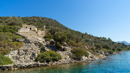 Obraz premium Ruins of Byzantine church and monastery on Camellia island in Aegean Sea, Turkey. Boat trips in Aegean Sea