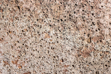 Porous brown stone texture, background.