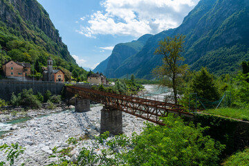 Standing beside an old rusty bridge structure