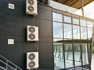 Industrial cooling system installed on the exterior of steel-framed building