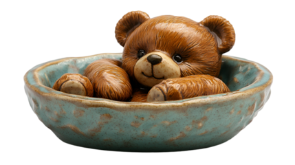 a toy bear in a bowl. 