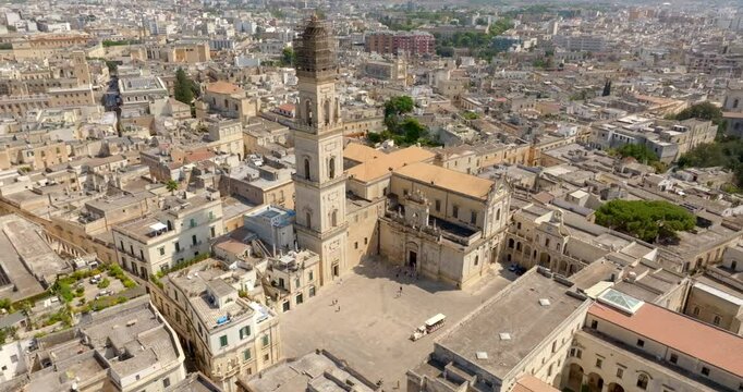 Aerial view of the cathedral of Lecce, in Apulia, Italy. The metropolitan cathedral of Santa Maria Assunta with its tall bell tower is located in Piazza del Duomo, in the historic center of the city.
