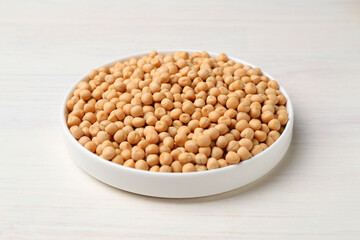 Dried peas on light wooden table, closeup