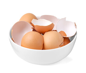 Broken eggshells in bowl isolated on white