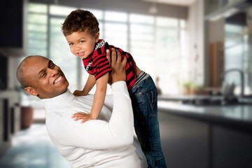 Dad and son have fun together at home