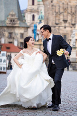 Wedding couple bride and groom in Prague. Couple in love, wedding marriage ceremony and event....