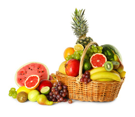 Many different fresh fruits in wicker basket isolated on white