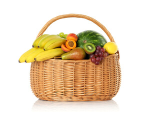 Many different fresh fruits in wicker basket isolated on white