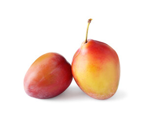 Two fresh ripe plums isolated on white