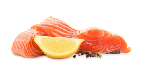 Pieces of fresh salmon, lemon and peppercorns isolated on white