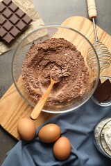 Ingredients for chocolate dough on grey table, flat lay