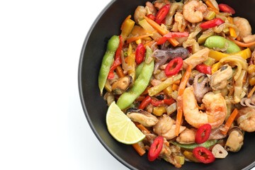 Stir-fry sea food in bowl on white background, top view