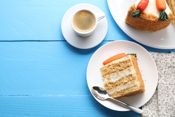 Delicious carrot cake served with coffee on blue wooden table, flat lay. Space for text