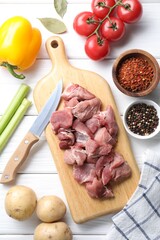 Cooking stew. Uncooked meat and vegetables on white wooden table, flat lay