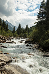 Obraz premium Krimmler Ache river is flowing through the Krimmler Achental valley in Austria