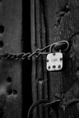 Chained style lock on wooden door.
This type of chain lock system was used in 19th century in Indian doors.