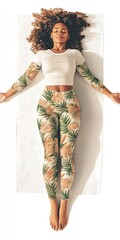 Woman in Floral Yoga Leggings Lying on White Mat
