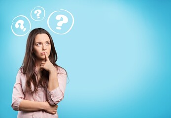 Worried young sad woman with a question mark