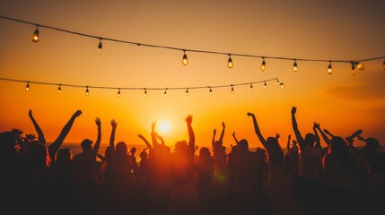 A lively crowd dances joyfully, silhouetted against a vibrant sunset at a summer festival. Festive lights create a warm atmosphere as people celebrate together