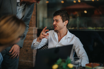 Expressive business professionals engaged in an animated discussion at a modern workspace, emphasizing collaboration, communication, and teamwork in a professional office setting.