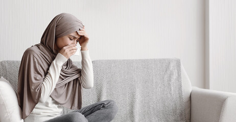 Flu And Cold Concept. Sick Muslim Girl In Hijab Suffering From Temperature And Runny Nose, Feeling...