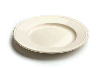A simple white plate sits on a table, ready for use