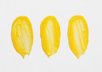 Background photography of textured smear of yellow moisturiser with coenzyme q10; face cream; serum;  example; natural skin care; cleansing oil; body oil; naturopathy; homeopathic