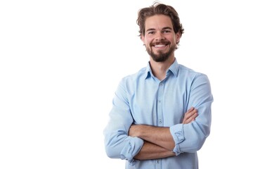 A man wearing a blue shirt with his arms crossed, looking serious or contemplative