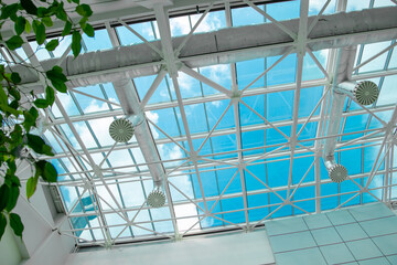 Blue sky above the glass roof