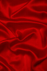 Red silk or satin luxury fabric texture can use as abstract background.