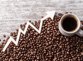 coffee beans with chart growth and cup