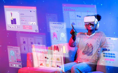 African girl looking list while wearing VR glass and sitting at sofa with shopping bag. Teenager...