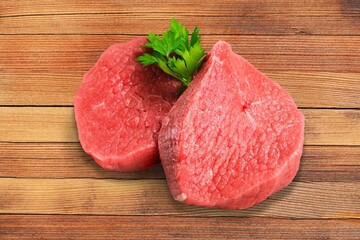 Tasty fresh meat raw steaks on  desk