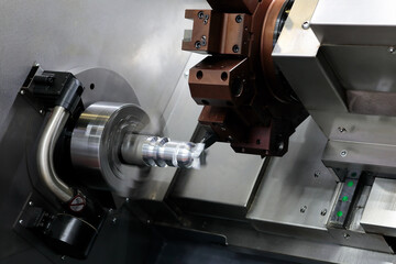 Manufacturing process on CNC lathe machine closeup