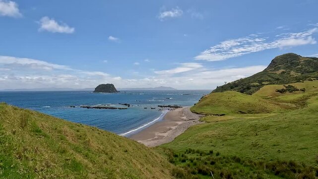 Fletcher Bay and its Rolling Hills along the remote Coromandel Coastal Walkway, Moehau Range, New Zealand