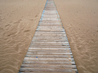 Fototapeta premium Wood footpath on the beach