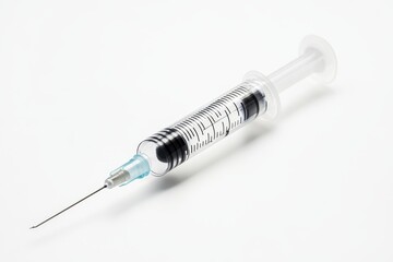 A syringe containing a vaccine against a white backdrop