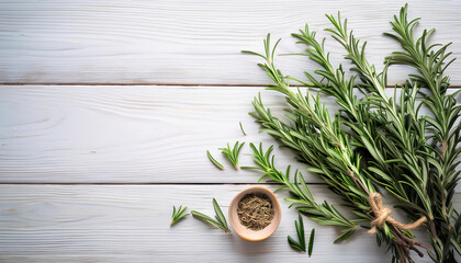 dry and fresh rosemary on a white wooden table with copy space