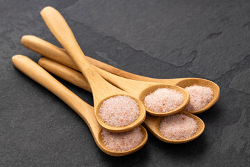 Pink fine salt - Fine Himalayan crystals in various spoons.