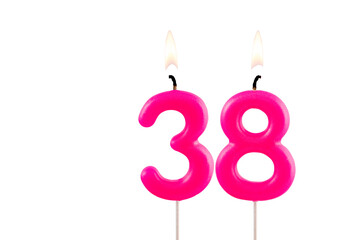 Pink number 38 birthday candle on white background