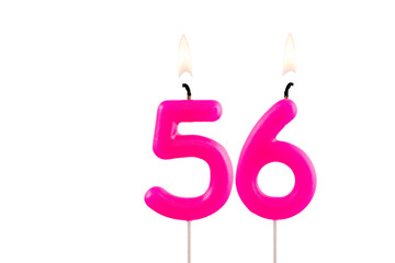 Pink number 56 birthday candle on white background