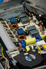 Electronic elements on the board on an exposed induction plate.
