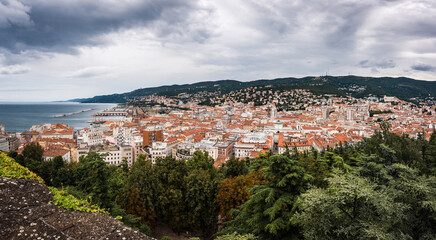Fototapeta premium Cityscape overview aerial panorama of Trieste a city and seaport in northeastern Italy in region of Friuli-Venezia Giulia.