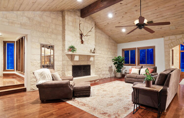 Cozy living room with a rustic design featuring natural materials and warm lighting in a spacious home