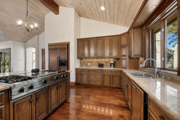 Spacious kitchen design featuring wooden cabinetry, modern appliances, and natural light in a contemporary home setting