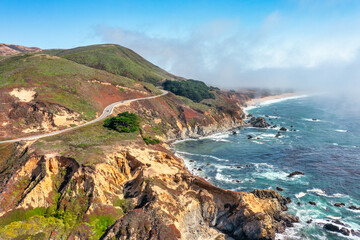 Beautiful landscape of Pacific Ocean coast along Highway 1 and Big Sur, aerial view, sunset, sunrise, fog. Concept, travel, vacation, weekend