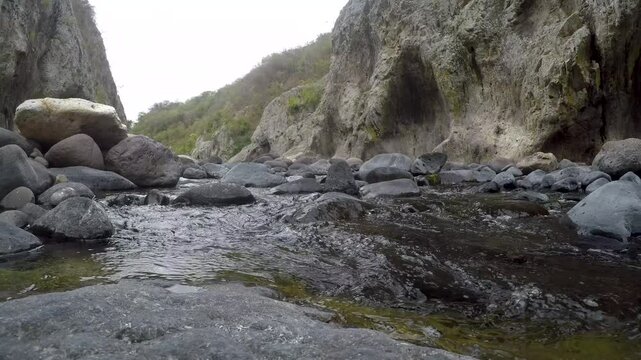 A low angle view of a river running through a Somoto Canyon