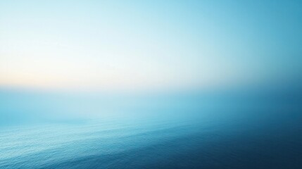 Obraz premium A soft gradient blue background transitioning from light blue at the top to deep blue at the bottom. Minimalist and serene.